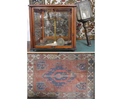 A lot comprising a mahogany cased set scientific scales, Victorian coach lamp and a terracotta ground nomadic tribal rug (3) 