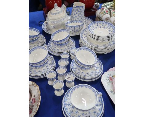 A Spode blue Fleur de Lis pattern part dinner service with plates, bowls, cups and saucers, side plates, jug, bowl and oval p