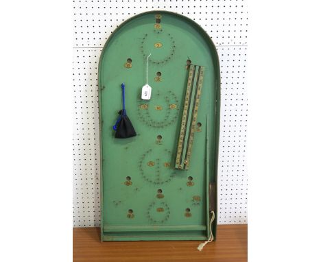 A vintage bagatelle board, painted in green and gold, measuring approx. 76cm in height, with coordinating scorer and marbles 