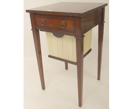 A 20th century mahogany sewing work table with single drawer over slide out hamper on square tapering supports, 75cm high x 4