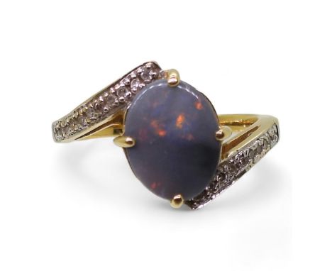 An 18ct gold opal and diamond ring, finger size N1/2, weight 4.4gms Condition Report:Available upon request