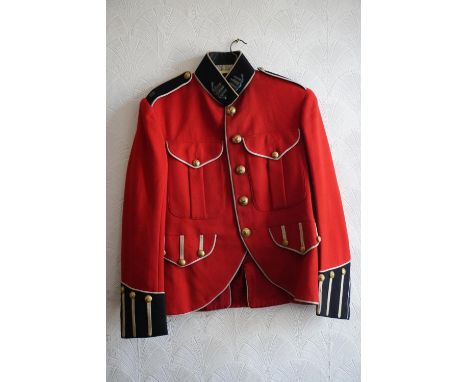 British army uniform, a red doublet jacket with Hawkes and Co of London label, having Hawkes and Co brass Kings Own Scottish 