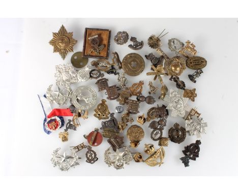 Large collection of cap badges to include Seaforth Highlanders Sans Peur, Cameronians, Highland Light Infantry, Royal Artille