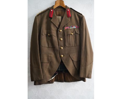 British army uniform, a khaki green jacket having medal ribbons for MBE, general service medal with mention in despatches oak