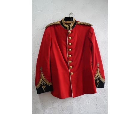 British army uniform, a red tunic jacket having The Queens Royal West Surrey Regiment brass buttons, with bullion wire knot e