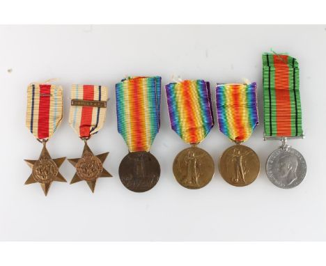 Two WWI victory medals [Z19 CPL R B STODDART SARFC] and [CPL R B STODDART SAAC], an Italian Allied Victory medal, a WWII defe