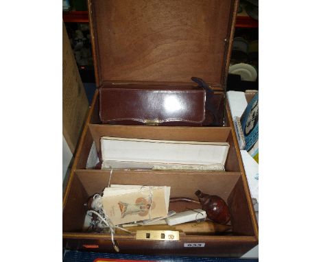 A BOX OF SUNDRIES, fans, pipe, cased gents wash set etc