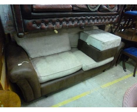 AN UPHOLSTERED THREE SEATER SETTEE, and a pouffe (2)