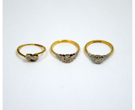 THREE DIAMOND RINGS, to include two single stone diamond rings and a two stone diamond ring with twisted abstract shank, all 