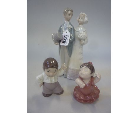 A LLADRO FIGURE GROUP, bride and groom, height approximately 20cm, and two small Nao children dressed as Spanish dancers (3)