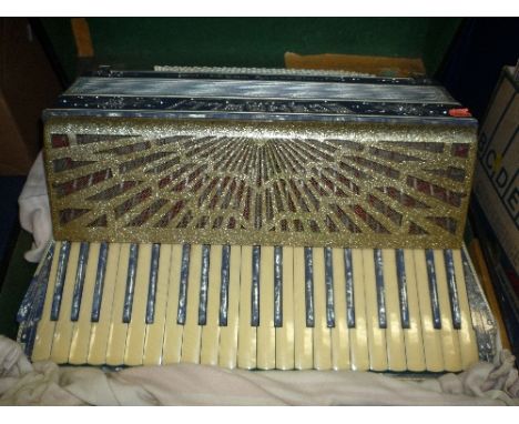 A SCANOLLI VIBRANTE THREE ACCORDION, in original case