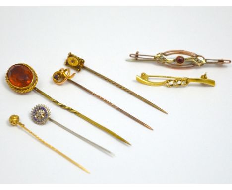 A COLLECTION OF STICK PINS, to include a boxed diamond stick pin and two brooches (6)