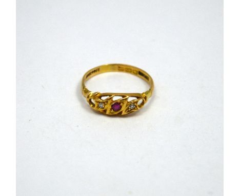 AN 18CT GOLD RUBY AND DIAMOND RING, the central ruby flanked by single cut diamonds, hall marks for Birmingham, ring size P