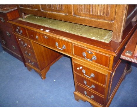 A MAHOGANY KNEE HOLE DESK, with eight drawers and leather inlay top (s.d.)