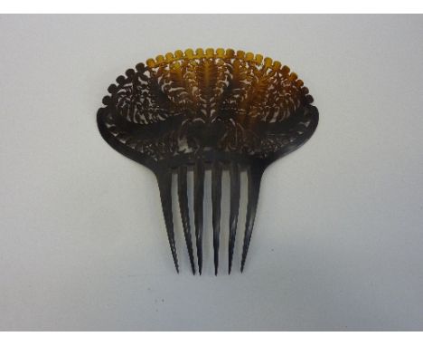 A 19TH CENTURY TORTOISESHELL HAIR COMB, pierced foliate decoration, 19cm