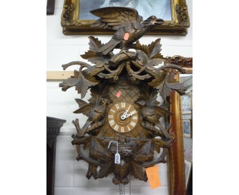 A MODERN LARGE BLACK FOREST CUCKOO CLOCK, with weight 