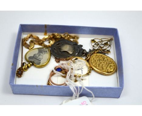 A SMALL COLLECTION OF JEWELLERY, to include lockets, an openwork pendant, chains, stick pins and a medal