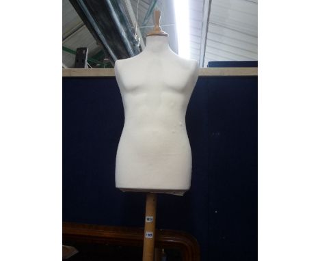 A MALE TORSO SHOP WINDOW MANNEQUIN, on tripod stand