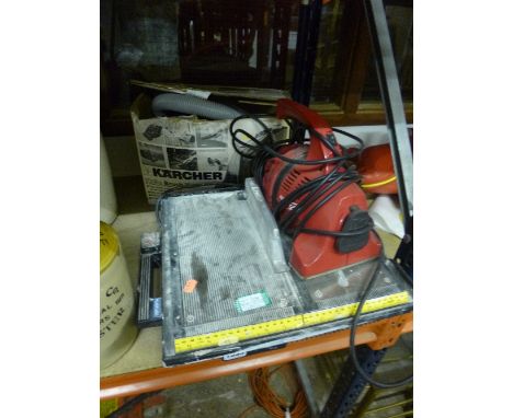 ONE KARCHER AND ONE HANDZIP HAND HELD VACUUM CLEANER, and a tile saw (3)