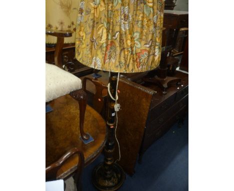 AN ORIENTAL DESIGN BLACK LAQUERED STANDARD LAMP, with shade and a wrought iron standard lamp with shade (2)