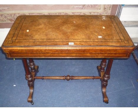 A 19TH CENTURY WALNUT INLAID FOLD OVER CARD TABLE