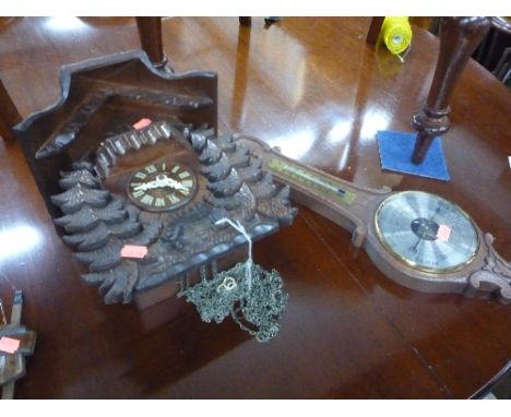 A MODERN BLACK FOREST STYLE CUCKOO CLOCK, and two barometers (pendulum and two weights) (3)