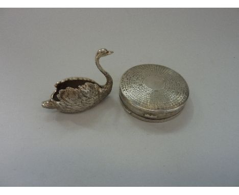 TWO ITEMS, to include a circular case and a silver ring stand in the shape of a swan