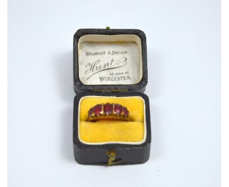 A VICTORIAN 9CT GOLD GARNET RING, with five graduated garnets to the plain tapered rose gold shank, hallmarks for Birmingham 