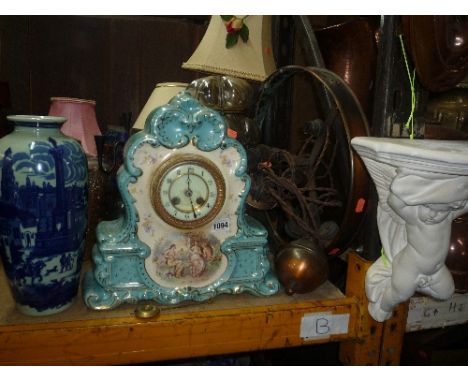 A CERAMIC MANTEL CLOCK, (pendulum), various table lamps, blue and white vase, cherub wall bracket etc