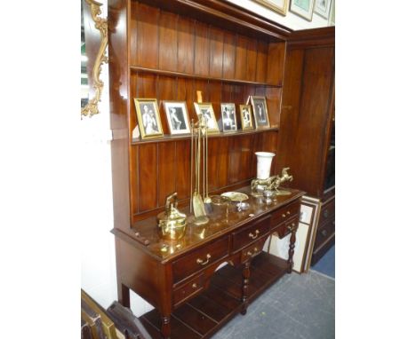 A GEORGIAN STYLE MAHOGANY DRESSER, plate rack above an arrangement of six various sized drawers and lower shelf