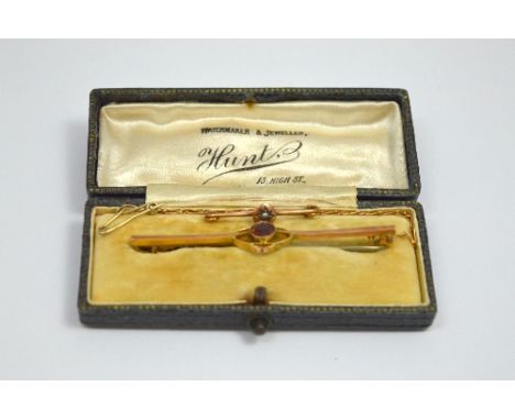 TWO BROOCHES, to include a fancy bar brooch within a fitted box together with a rose gold coloured bar brooch with pearl deta