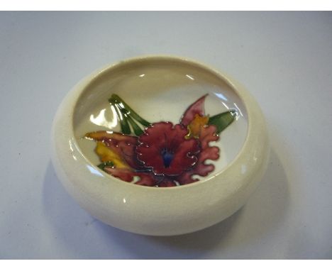 A MOORCROFT POTTERY TRINKET DISH, Orchid pattern, blue impressed marks, diameter approximately 11cm