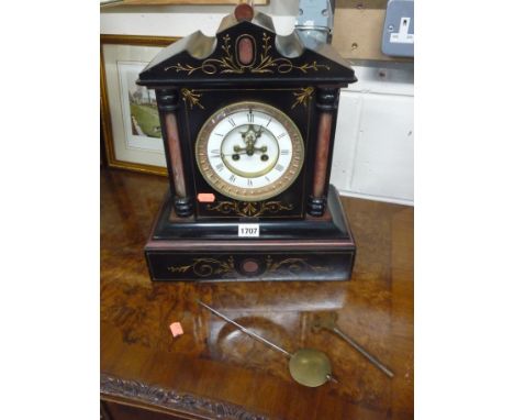 A VICTORIAN BLACK SLATE AND ROSE MARBLE MANTLE CLOCK, with visible escapement