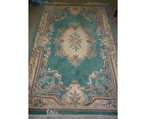 A GREEN GROUND CARPET, approximate size 240cm x 158cm