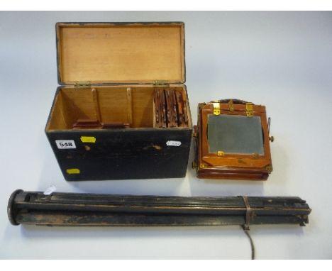 A BOXED MAHOGANY FOLDING BELLOWS CAMERA, with wooden tripod (2)