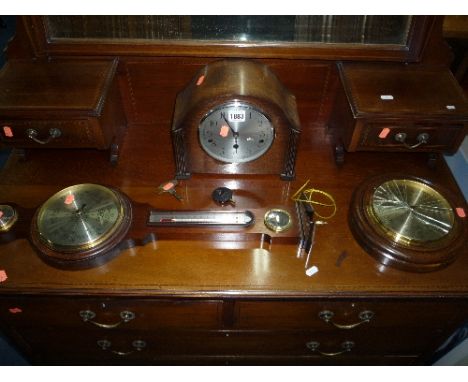 AN OAK MANTLE CLOCK, and two barometers (s.d.) (key and pendulum)