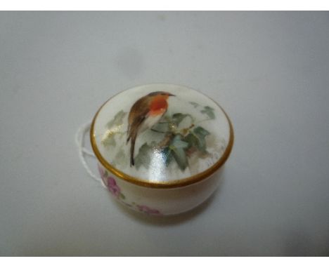 A ROYAL WORCESTER MINIATURE COVERED POT, painted Robin, signed W. Powell