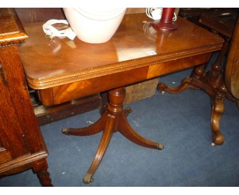 A MAHOGANY FOLD OVER CARD TABLE