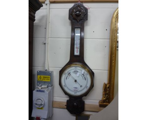 AN OAK CASED BAROMETER