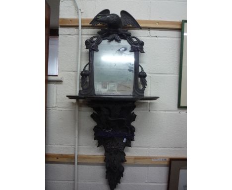 A RECENT BLACK FOREST WALL MIRROR, with eagle mount and shelf and a similar wall shelf (2)
