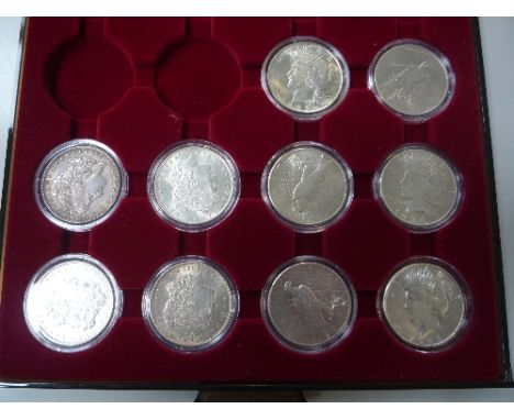 A COIN TRAY CONTAINING FOUR MORGAN AND SIX PEACE DOLLARS, to include a rare 1928 Philadelphia Mint Peace Dollar in f/ef condi