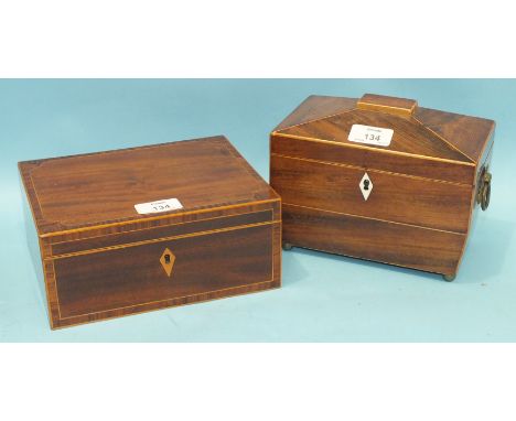 An early-19th century mahogany sarcophagus-shaped tea caddy with brass carrying handles, interior fitments lacking, 21cm wide