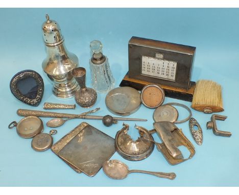 An engine-turned perpetual calendar, (N/W), a loaded plain sugar castor, (damages) and other silver and metal ware.