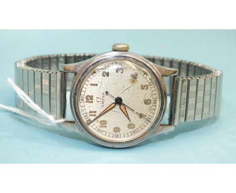 Omega, a gentleman's steel-cased wrist watch c1944, with Arabic numerals and centre sweep seconds, the movement numbered 8953