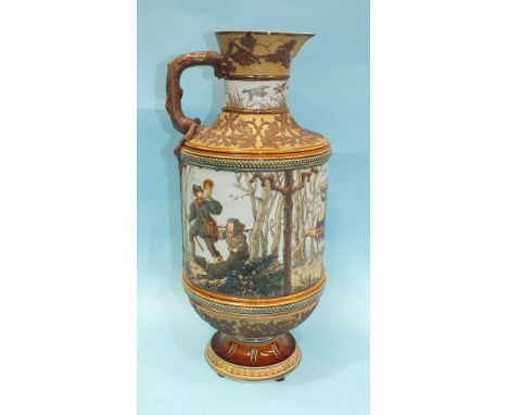 A large Geschutzt Mettlach ewer decorated with figures hunting and having bands of applied oak leaf and branch decoration, im