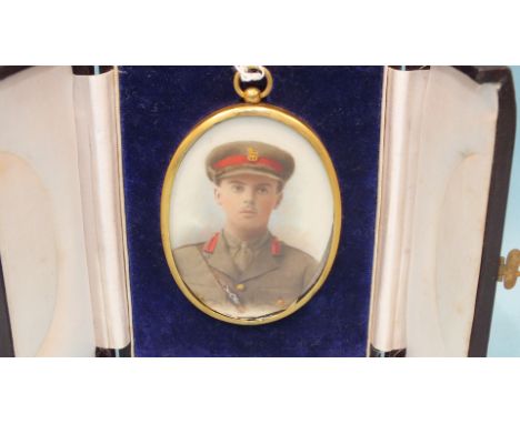 A watercolour study of a WWI Army Officer in military uniform, 7 x 5.5cm, in fitted enclosed case, a coloured photographic po