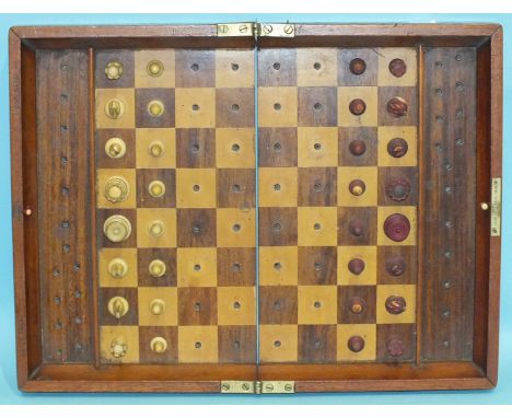 J Jaques & Son, a travelling chess board with retained turned ivory pieces within the folding board, 32 x 22cm closed, presen