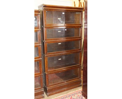 A collection of Globe Wernicke and Company Ltd bookcase sections, comprising five base and cornice sections and fourteen inte