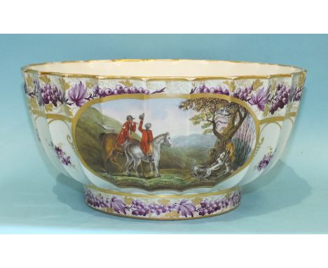 A Paris porcelain bowl of circular fluted form painted with vignettes of deer and a fox hunting scene, within puce vine and f