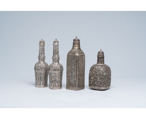 Full title: Four reticulated Persian silver and glass decanter flasks, Qajar, Iran, 19th/20th C.Description: H 28 - 21,7 cm (